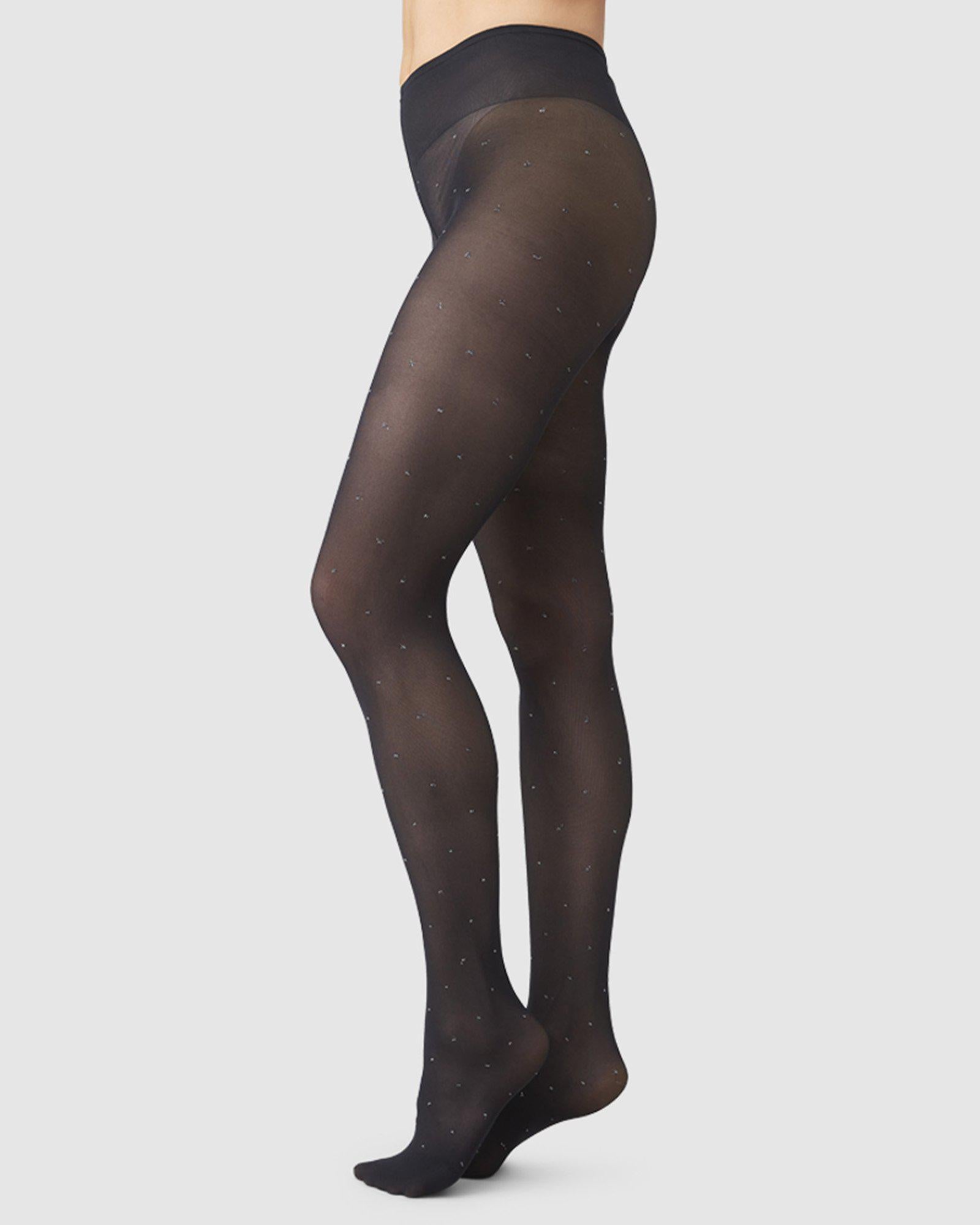 http://swedishstockings.com/cdn/shop/products/113008001-filippa-dots-tights-black-swedish-stockings-1.jpg?v=1657109985