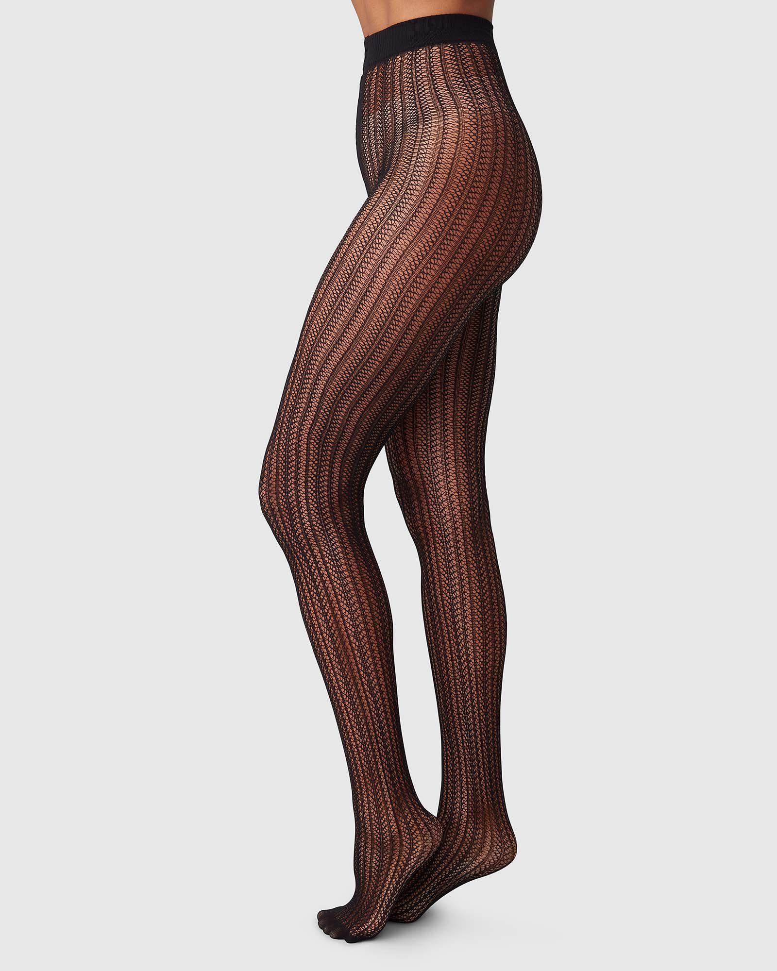 http://swedishstockings.com/cdn/shop/products/113016001-selma-net-tights-black-swedish-stockings-1.jpg?v=1695726986
