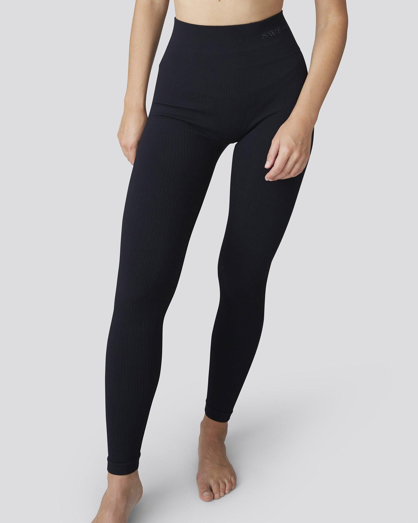 https://swedishstockings.com/cdn/shop/products/131003001-tyra-rib-leggings-black-swedish-stockings-2_x2400.jpg?v=1657099668